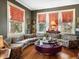 Unique living room featuring hardwood floors, large windows, and colorful decor at 2400 Fairview Rd, Raleigh, NC 27608