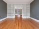 Spacious living room featuring built-in bookshelves and hardwood flooring at 2400 Fairview Rd, Raleigh, NC 27608