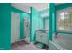 Bathroom with jacuzzi tub and glass enclosed shower; features bright blue walls at 2401 Worthing Ct, Wake Forest, NC 27587