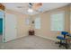 Bedroom featuring neutral carpet, fan, and two windows at 2401 Worthing Ct, Wake Forest, NC 27587