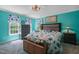 Nautical-themed bedroom with bright blue walls and decor with two windows bringing in natural light at 2401 Worthing Ct, Wake Forest, NC 27587