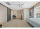 Roomy bedroom featuring neutral carpet, large windows, and ceiling fan at 2401 Worthing Ct, Wake Forest, NC 27587