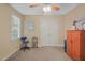 Cozy bedroom with neutral carpet, fan, window, closet, and wardrobe at 2401 Worthing Ct, Wake Forest, NC 27587