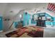 Large bonus room featuring stairs, a wet bar, and bright blue walls at 2401 Worthing Ct, Wake Forest, NC 27587