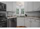 Kitchen featuring granite counters, undermount sink and stainless steel dishwasher at 2401 Worthing Ct, Wake Forest, NC 27587