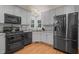 Bright kitchen boasts stainless steel appliances, granite counters and ample cabinet space at 2401 Worthing Ct, Wake Forest, NC 27587