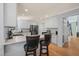 Well-lit kitchen featuring granite countertops, and white cabinets at 2401 Worthing Ct, Wake Forest, NC 27587