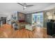 Living room with hardwood floors, comfortable seating, and access to other rooms at 2401 Worthing Ct, Wake Forest, NC 27587