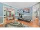 Bright living space with hardwood floors, blue accent walls, and neutral-toned decor at 2401 Worthing Ct, Wake Forest, NC 27587