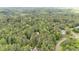 Photo of home surrounded by mature trees and lush landscaping, conveniently located near roadways at 2612 Scarlet Sage Ct, Raleigh, NC 27613