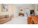 Neutral finished basement with a comfy couch, decor, desk, and a window for natural light at 2612 Scarlet Sage Ct, Raleigh, NC 27613