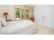 Bedroom with a comfortable bed, three windows providing natural light, and a closet for ample storage at 2612 Scarlet Sage Ct, Raleigh, NC 27613