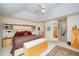 Carpeted bedroom featuring modern furniture, ceiling fan, and modern finishes at 2612 Scarlet Sage Ct, Raleigh, NC 27613