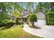 Charming home with a well-maintained front yard, mature trees, and an attached two-car garage at 2612 Scarlet Sage Ct, Raleigh, NC 27613