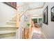 Bright foyer with staircase, hardwood floors, and modern decor at 2612 Scarlet Sage Ct, Raleigh, NC 27613