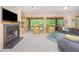 Basement living room featuring a fireplace, sliding doors to the exterior, and comfortable seating for relaxing at 2612 Scarlet Sage Ct, Raleigh, NC 27613