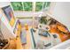 Bright living room with vaulted ceilings, large windows, hardwood floors, fireplace, and deck access perfect for entertaining at 2612 Scarlet Sage Ct, Raleigh, NC 27613