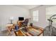 This bedroom includes an excercise bike and a desk space at 2708 Chert Ln, Raleigh, NC 27610