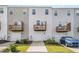 Exterior of townhomes with front garages and balconies at 2708 Chert Ln, Raleigh, NC 27610
