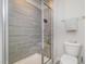 Walk-in shower with modern fixtures and tiled walls inside this bright bathroom at 2708 Chert Ln, Raleigh, NC 27610