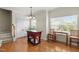 Bright dining area with hardwood floors, an island, and natural light from the two windows at 276 Linden Park Ln, Cary, NC 27519