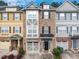 Beautiful townhome featuring a symmetrical elevation, driveway, manicured lawn and neutral color palette at 276 Linden Park Ln, Cary, NC 27519