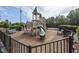 Playground and benches surrounded by a secure fence offer a wonderful space for children at 276 Linden Park Ln, Cary, NC 27519