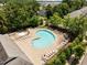 Community pool and spa with lounge chairs are surrounded by lush landscaping at 276 Linden Park Ln, Cary, NC 27519