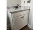 Modern bathroom with granite countertops, black hardware, and white shaker cabinets at 2760 Rains Mill Rd, Princeton, NC 27569