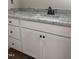 Modern bathroom with granite countertops, black hardware, and white shaker cabinets at 2760 Rains Mill Rd, Princeton, NC 27569