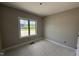 Bedroom with large window offering views of the green, pastoral landscape and rough-in electric at 2760 Rains Mill Rd, Princeton, NC 27569