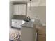 Modern kitchen island with granite countertops and white cabinets, with a pendant light fixture at 2760 Rains Mill Rd, Princeton, NC 27569