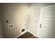 Laundry room featuring utility hookups and door to the left; the room awaits flooring at 2760 Rains Mill Rd, Princeton, NC 27569