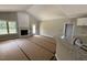 Bright living room featuring a fireplace, large window, and access to an outdoor deck at 2760 Rains Mill Rd, Princeton, NC 27569