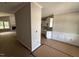 Open-concept living room and kitchen area under construction, showcasing crisp white trim work and natural light at 2760 Rains Mill Rd, Princeton, NC 27569