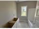 Bathroom with modern, white vanity and hardware with unfinished flooring and a shower at 2776 Rains Mill Rd, Princeton, NC 27569