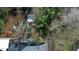 A scenic aerial view showcases the property's lush landscaping and guest house at 2907 University Dr, Durham, NC 27707