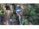 Expansive aerial shot displays the guest house, stone path, and overall property layout at 2907 University Dr, Durham, NC 27707