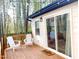 Relaxing outdoor deck with white Adirondack chairs and string lights amidst a bamboo forest at 2907 University Dr, Durham, NC 27707