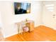 Home office space featuring a desk with a pink velvet stool and TV at 2907 University Dr, Durham, NC 27707