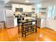 Updated kitchen with stainless steel appliances, sleek cabinetry, and dining area at 2907 University Dr, Durham, NC 27707