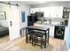 Efficient kitchenette features modern appliances and a charming dining area at 2907 University Dr, Durham, NC 27707