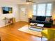 Cozy living area features hardwood floors, natural light, and comfortable seating at 2907 University Dr, Durham, NC 27707