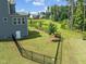 Great backyard view with black fence and water feature on the property at 3053 Roy Ct, Apex, NC 27523