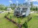Spacious backyard with a covered patio, perfect for outdoor entertaining, and a well-maintained lawn enclosed by a fence at 3053 Roy Ct, Apex, NC 27523