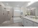 Modern bathroom with a glass-enclosed shower and a soaking tub at 3053 Roy Ct, Apex, NC 27523