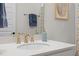 Bathroom featuring a white countertop, gold hardware, and blue accents at 3053 Roy Ct, Apex, NC 27523