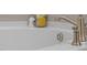 Close-up of a luxurious white bathtub with brushed nickel fixtures at 3053 Roy Ct, Apex, NC 27523