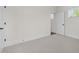 Empty bedroom featuring neutral carpet, paint and an entrance to the ensuite bathroom at 3053 Roy Ct, Apex, NC 27523