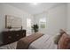 Cozy bedroom with a dresser, neutral color scheme, and an ensuite bathroom at 3053 Roy Ct, Apex, NC 27523